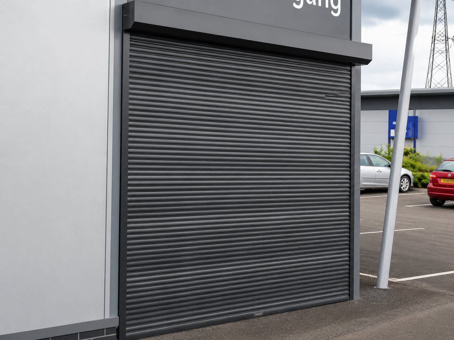 Aluminium rolling shutter motorised drive and control installation — operational view